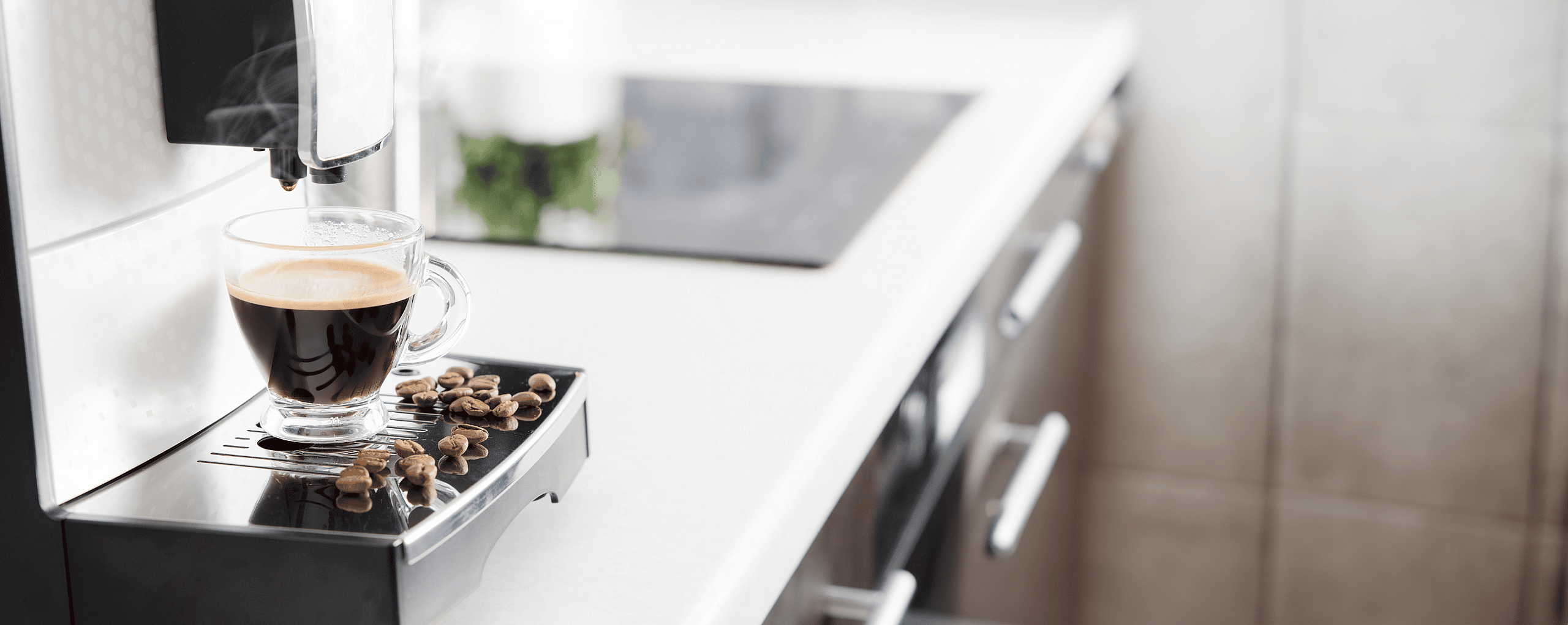 Close-up of a coffee machine pouring espresso into a glass cup, showcasing the latest office and commercial coffee machines available for leasing with affordable instalments and no upfront costs.