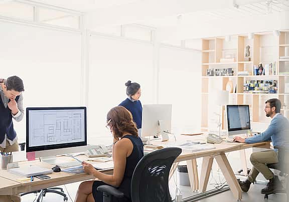 Modern office workspace with equipment covered by grenke's Equipment Protection.