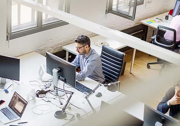 Modern office workspace with equipment covered by customer's own Equipment Protection.
