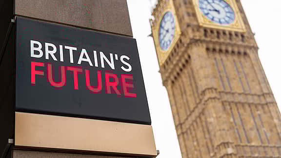Britain's Future written on a sign with Elizabeth Tower and Big Ben in the background