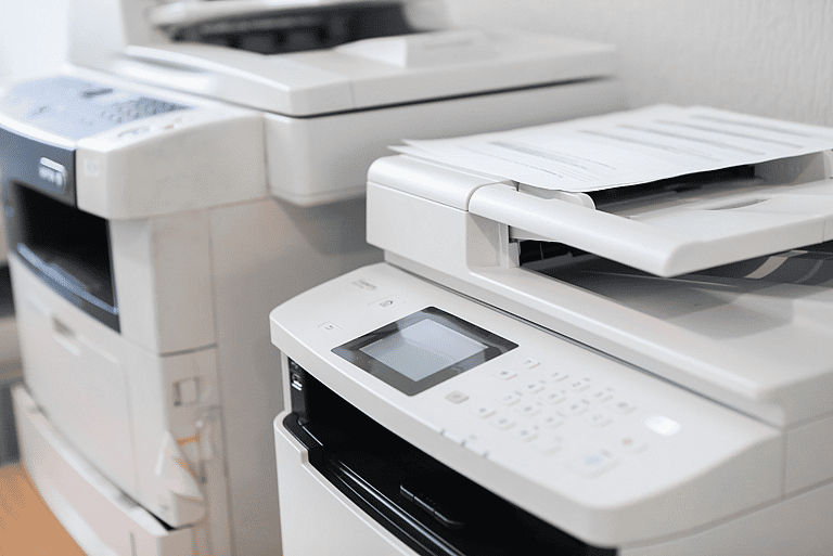 Two copiers side by side, representing grenke’s asset financing solutions for businesses of all sizes. Ideal for entrepreneurs and multinational companies seeking flexible copier leasing options.